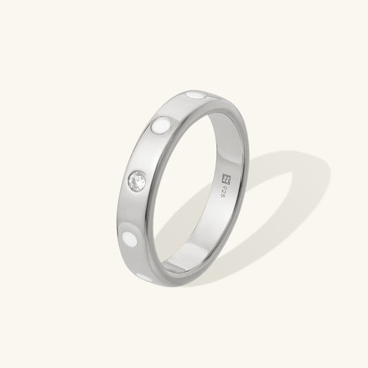 Classic designer style, sterling silver ring. Set with single lab grown diamond and white enamel.