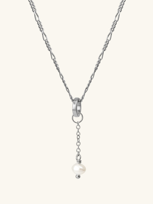 Single freshwater cultured pearl drop add-on charm suspended from figaro chain using connector ring in sterling silver. L'ERA Jewellery