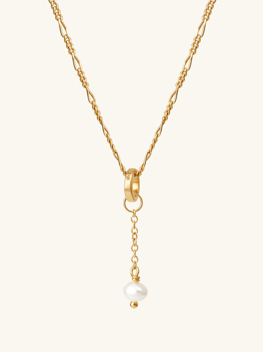 Single freshwater cultured pearl drop add-on charm suspended from figaro chain using connector ring in gold vermeil. L'ERA Jewellery