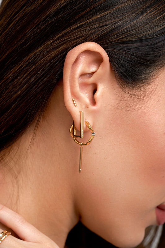 lady wearing gold ear stack