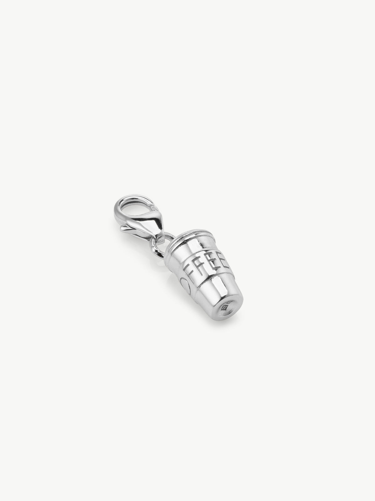 Coffee cup charm in silver laying flat
