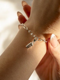 model wearing Coffee cup charm on bracelet in silver