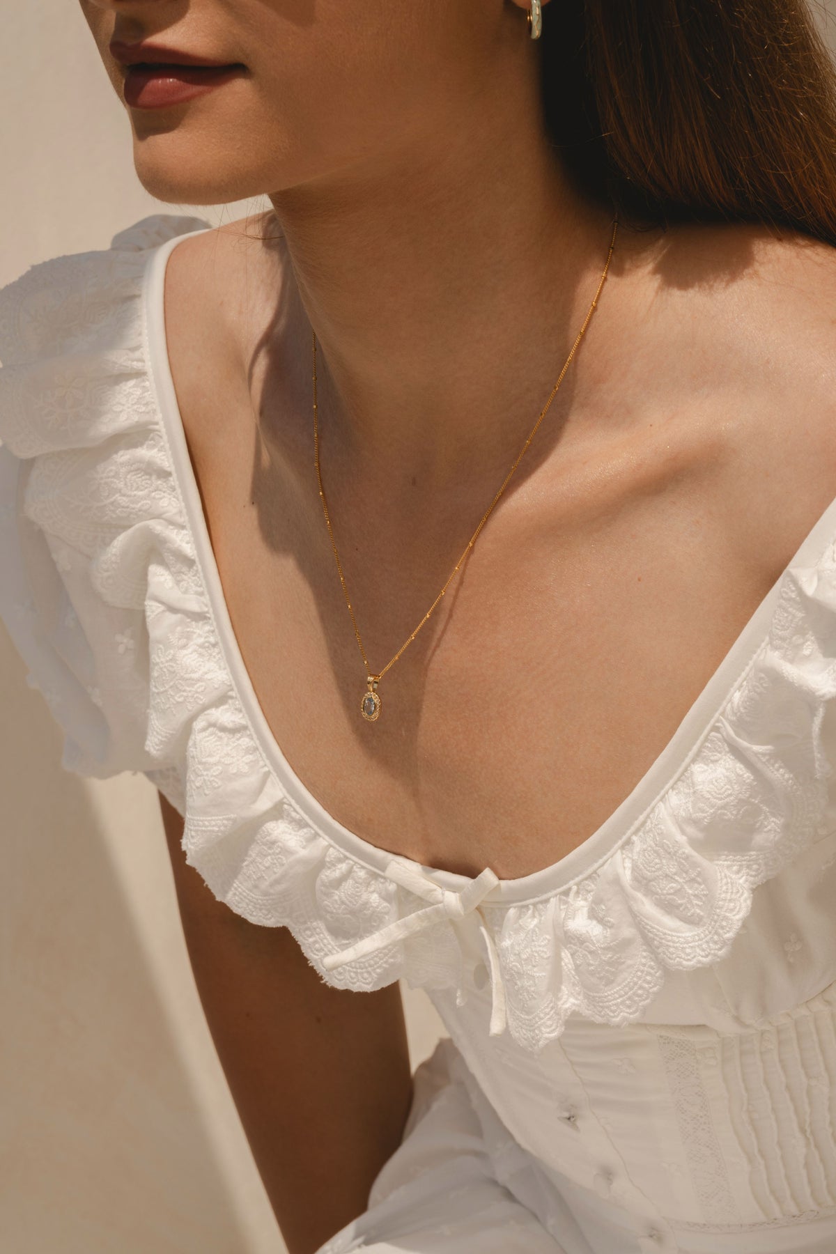 model wearing Daphne Aquamarine pendant gold vermeil