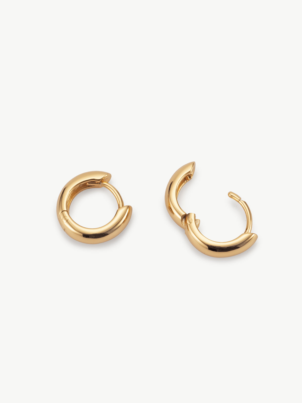 Huggie hoop earrings in 18ct gold vermeil different angle