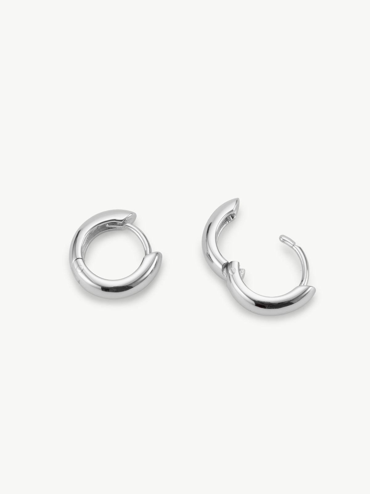 Huggie hoop earrings in sterling silver different angle