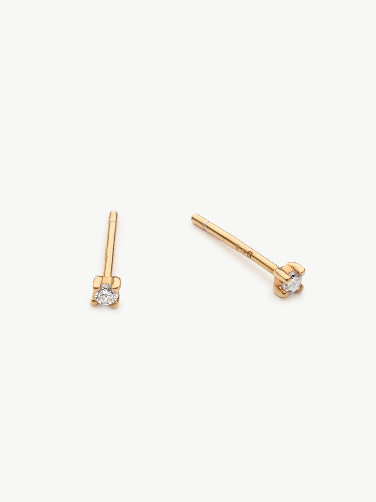 Mini diamond studs in gold vermeil different angle