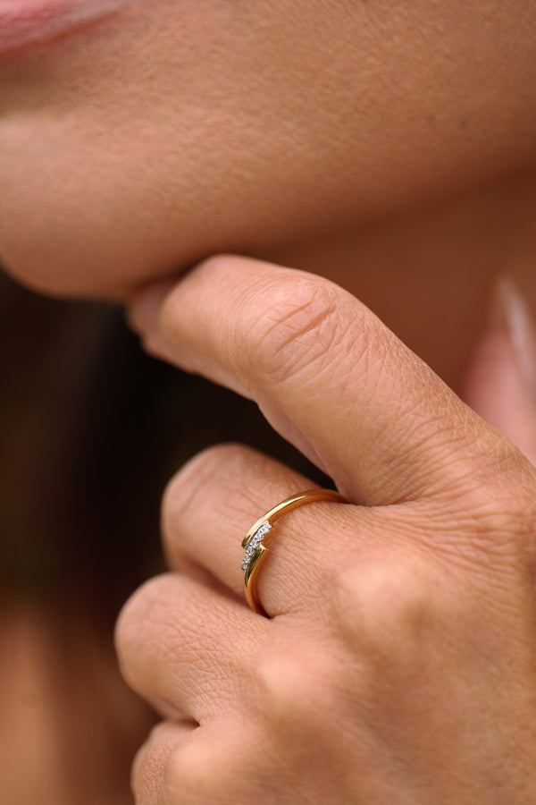 Woman wearing Crossover Diamond Ring in gold