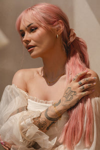 Talia Mar wearing Pair of gold vermeil Ophelia enamel hoop earrings with nature detail 