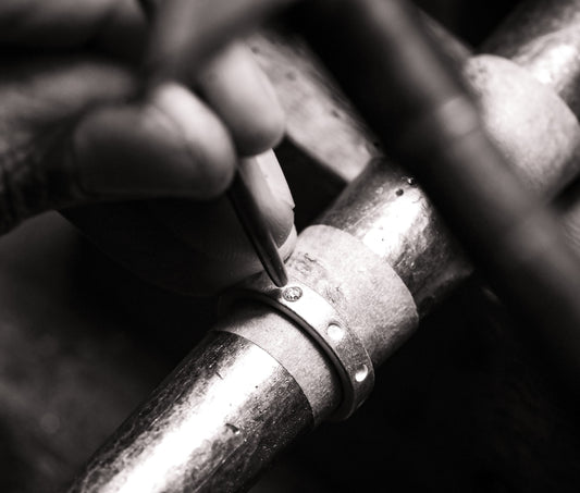 Dotty ring being made. Hand finished ring with diamond during production.