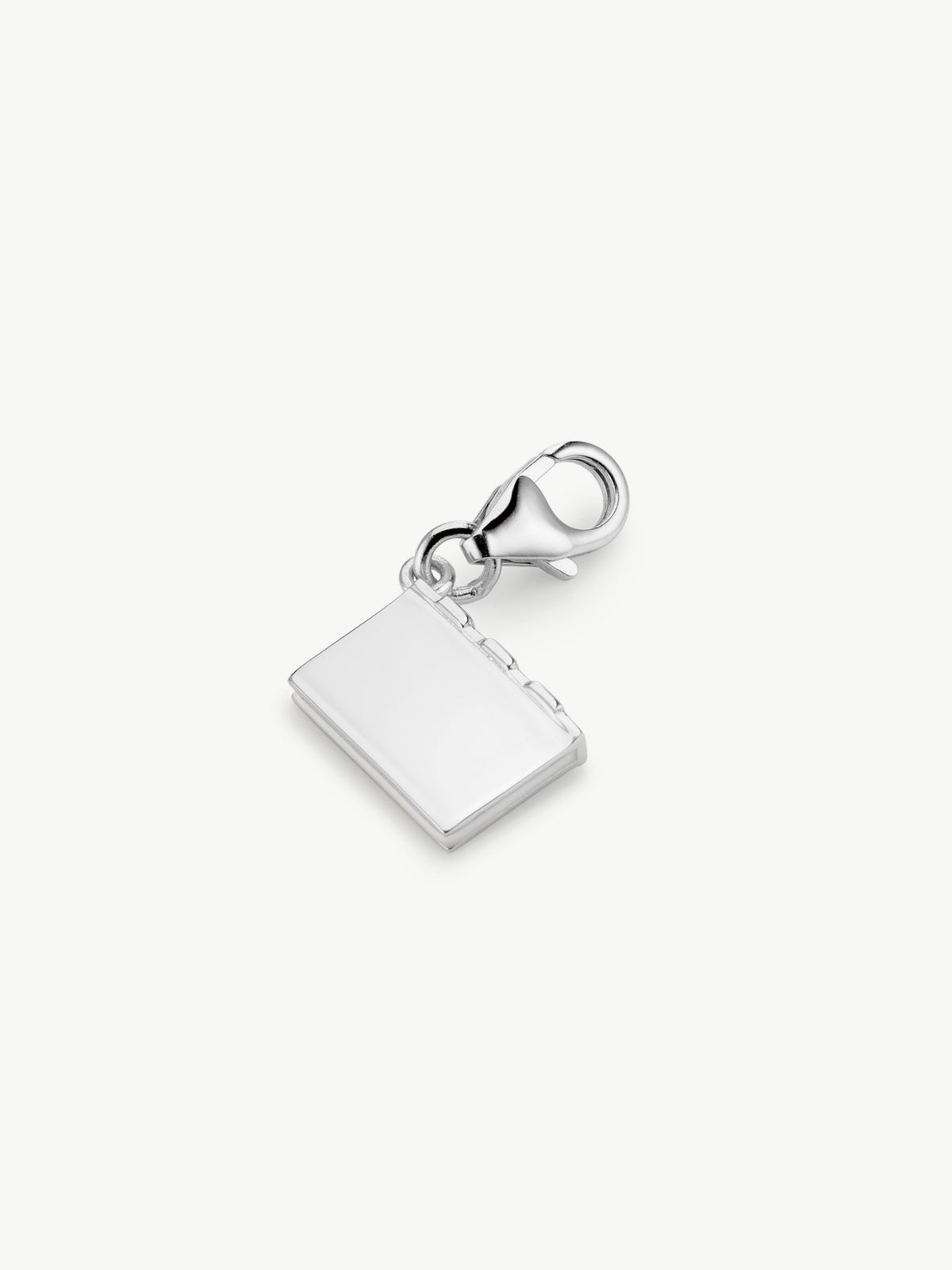 enamel book charm in silver laying flat