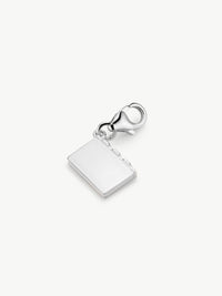 enamel book charm in silver laying flat