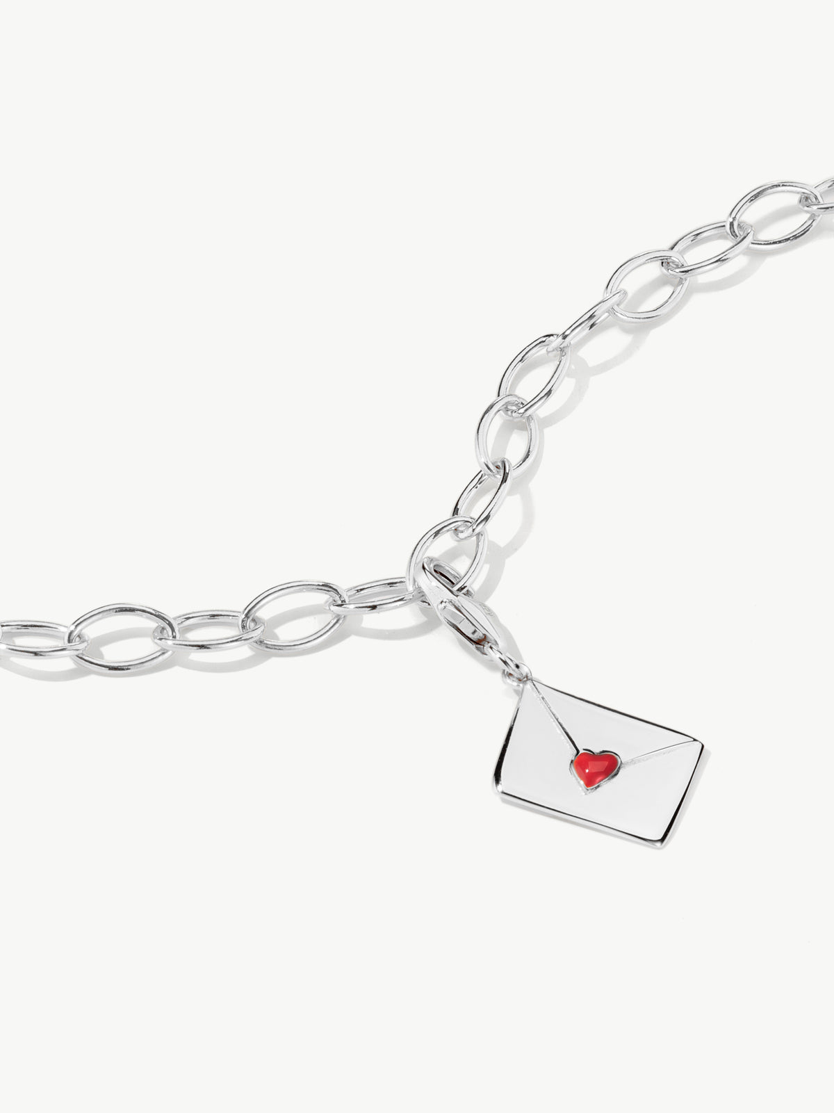enamel letter charm with red heart on bracelet in silver