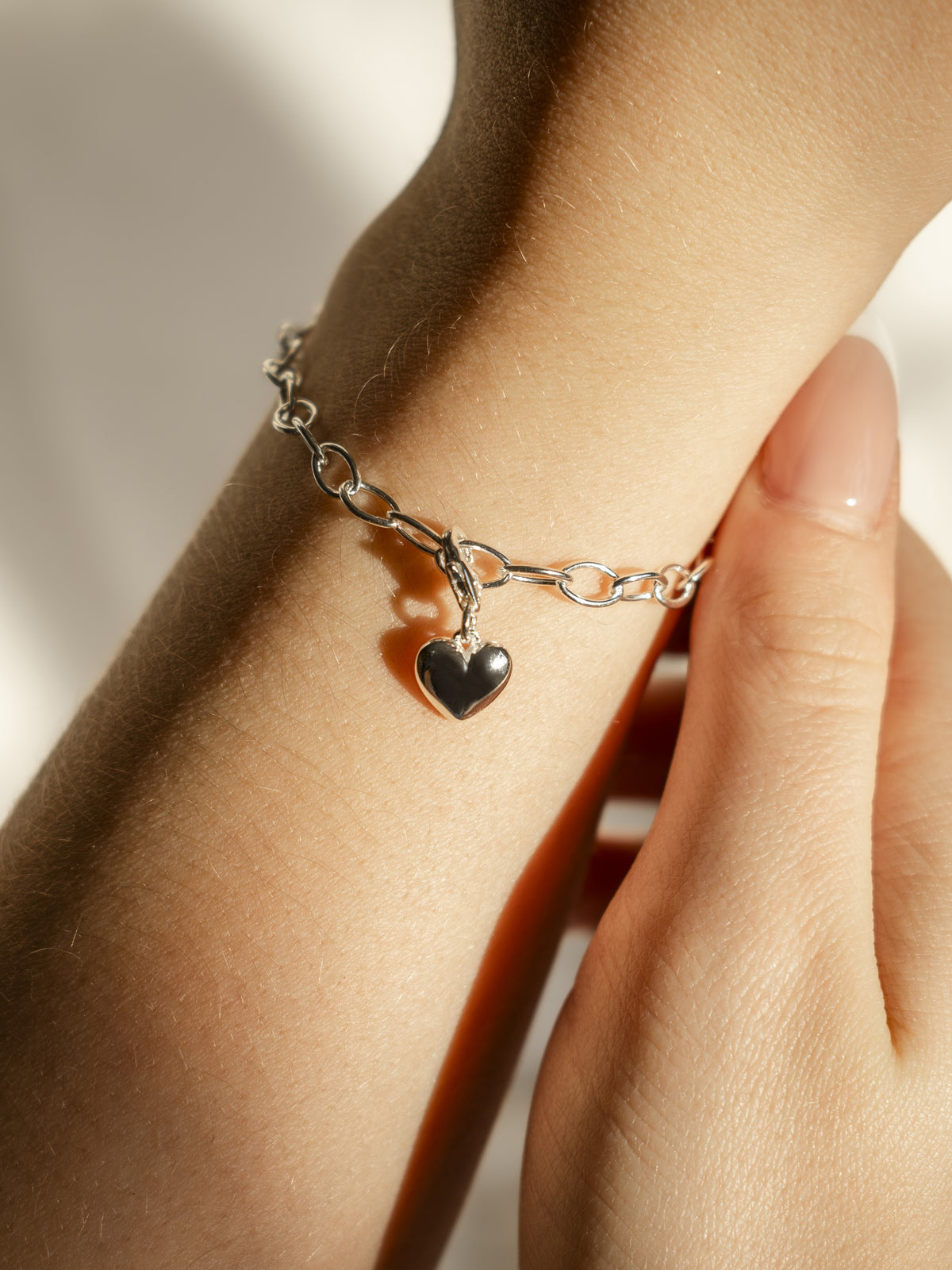 heart charm on Storia charm bracelet in silver