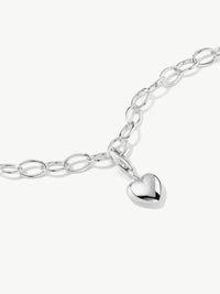 heart charm on bracelet in silver