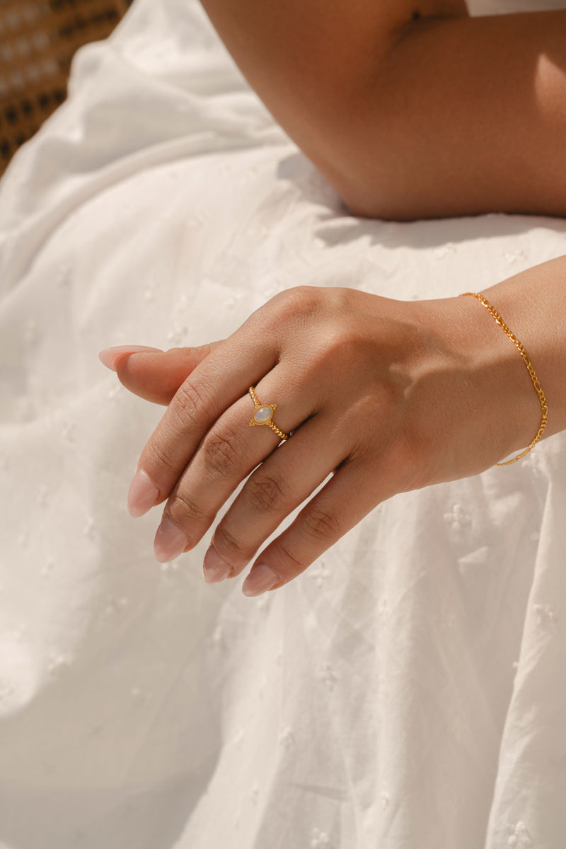 Model wearing L'ERA's lab-grown opal beaded ring in 18ct gold vermeil