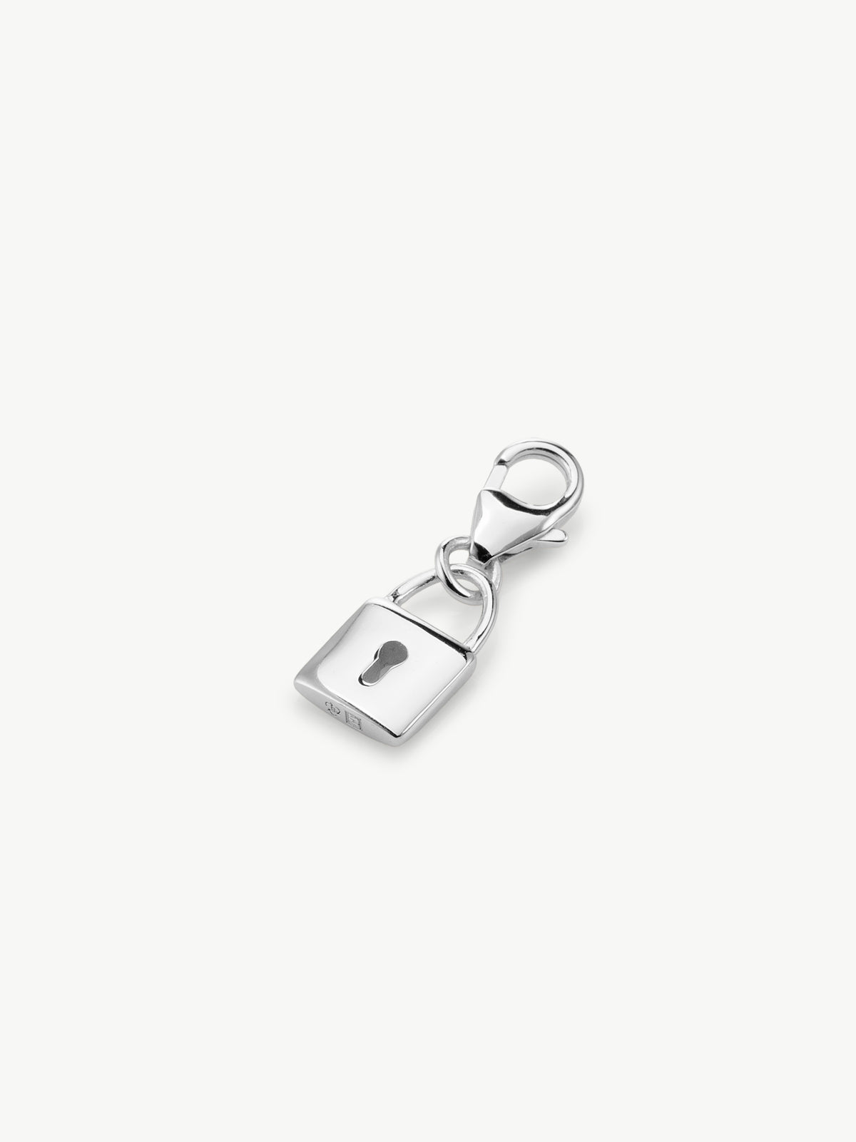 lock charm in silver laying flat